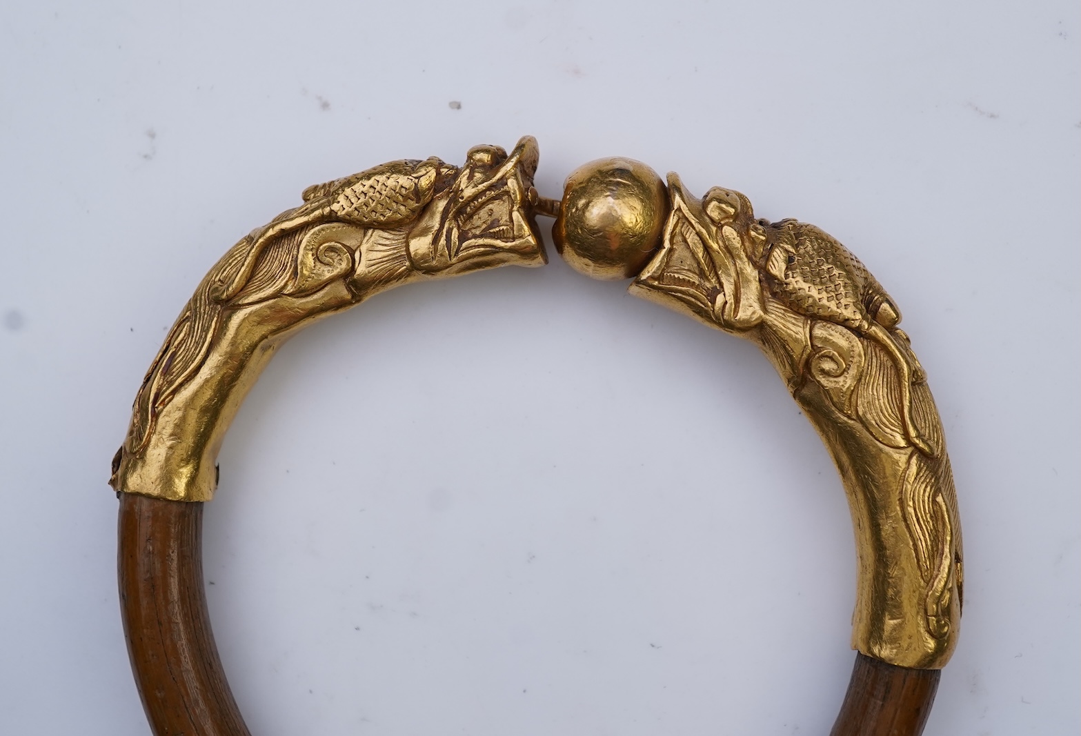 A gold and wood bangle, China, late 19th/early 20th century